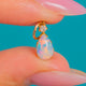 Edwardian 9ct Gold Pear-Shaped Opal & Diamond Charm, front view of the Opal colour and Diamond accent