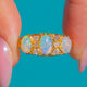 Victorian 18ct Gold Opal & Diamond Bows Ring c. 1897 — front on blue