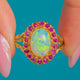18ct Gold Opal Ruby cluster ring, front view of the oval face