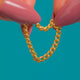 Antique 15ct Gold Curb Link Chain Ring, complete curb chain ring against blue